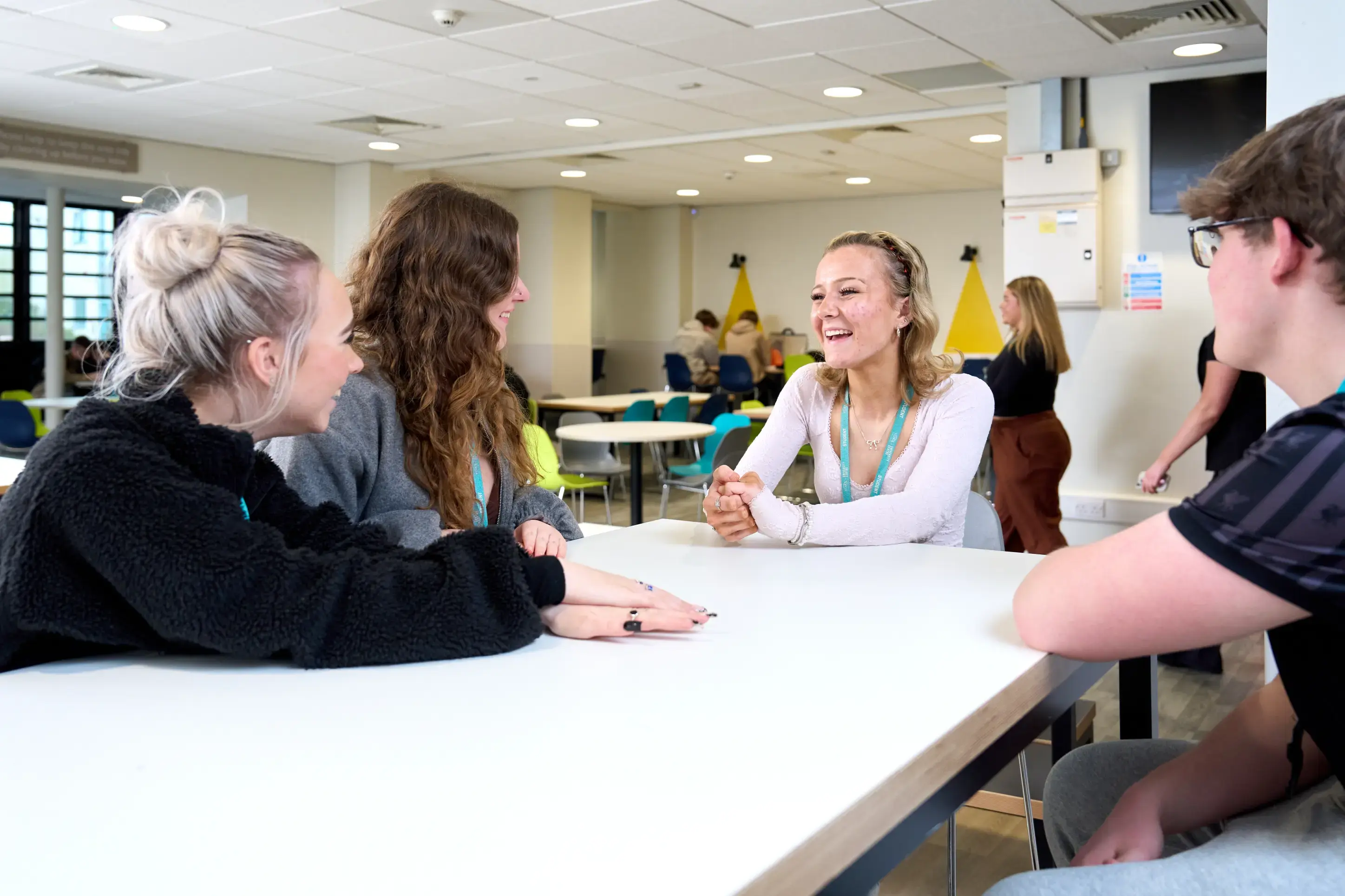 Four students socialising in break area