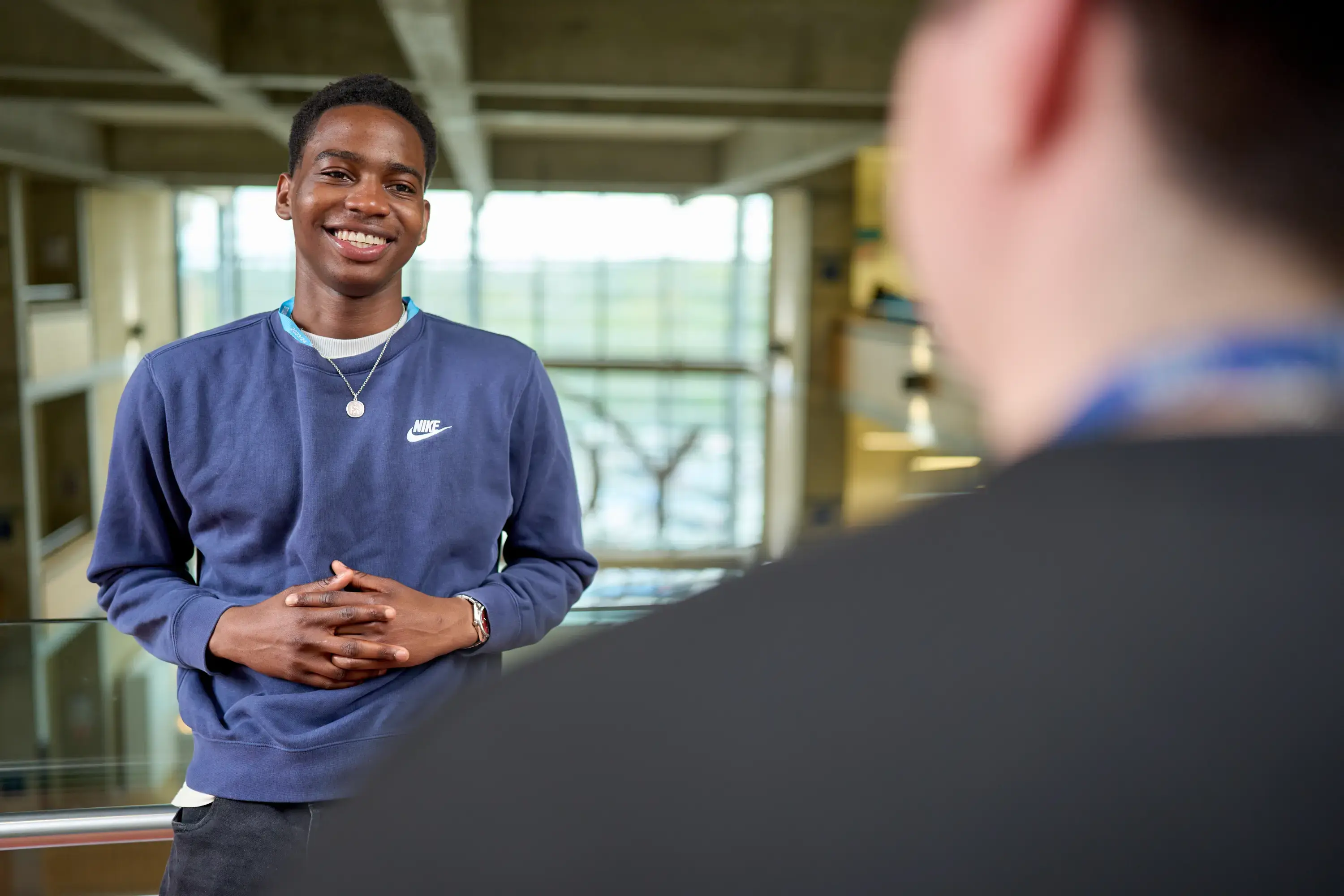 Student smiling on balcony