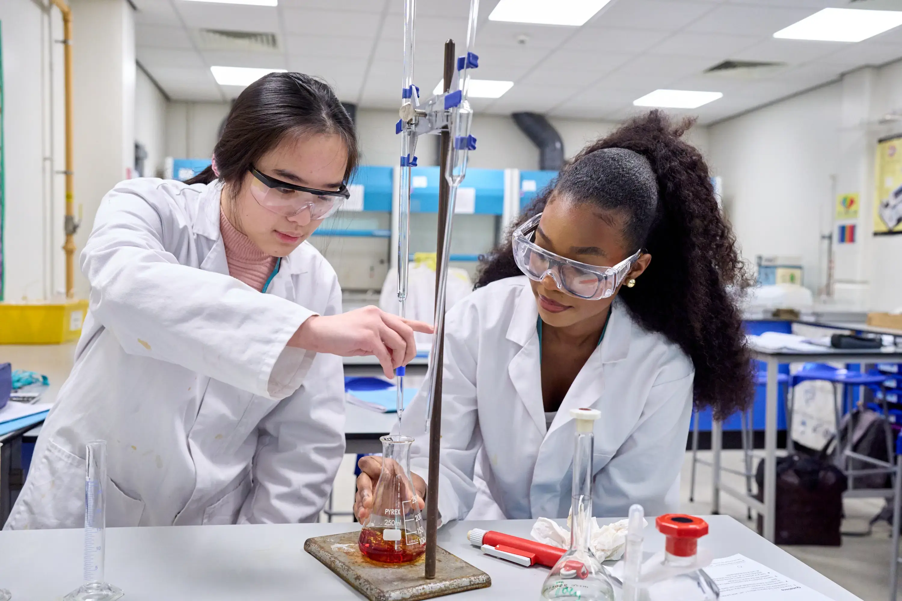 Two students in chemistry lab