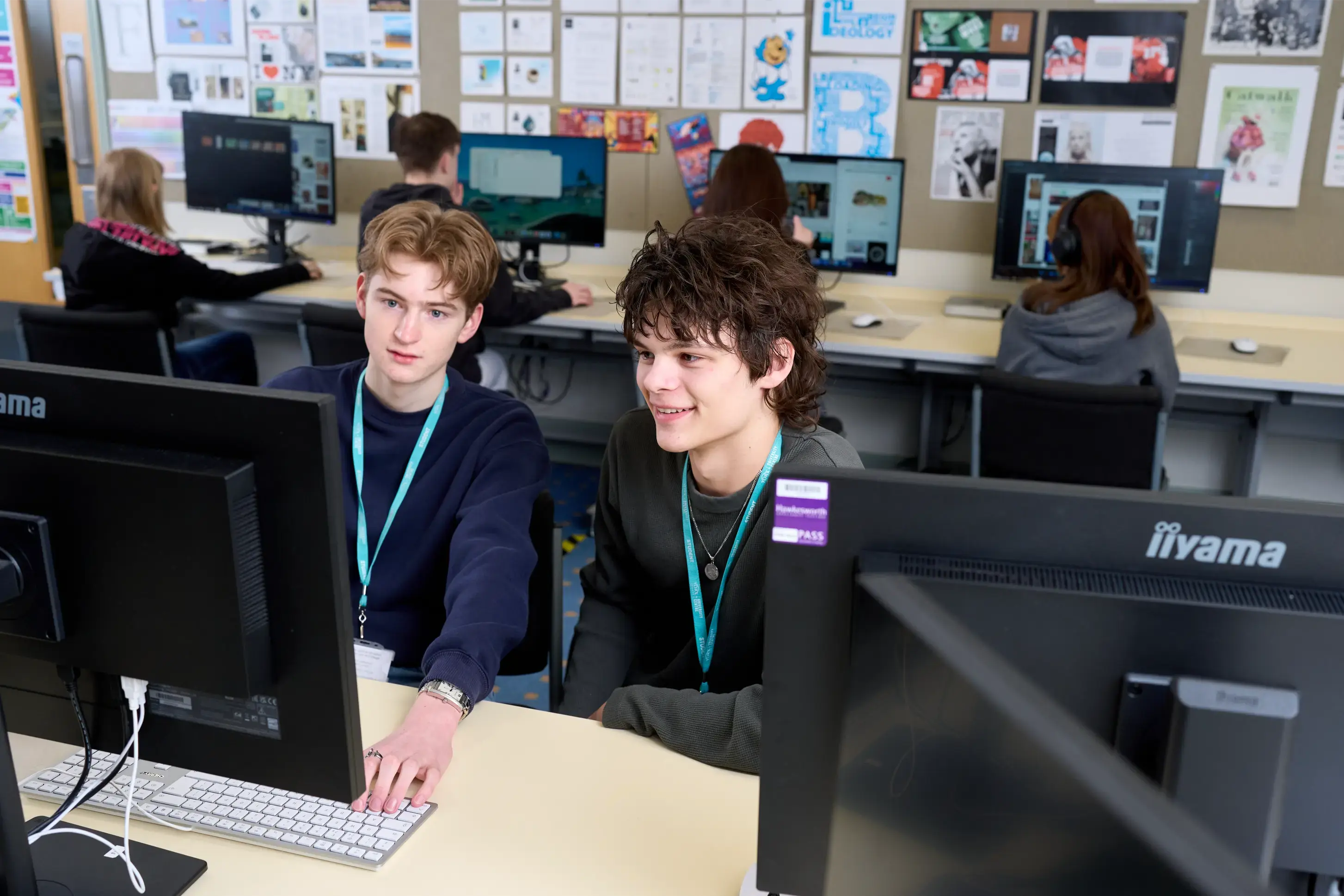 Two students sat in computer suite
